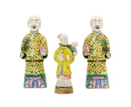 ~ A Pair of Chinese Porcelain Figures of Immortals, Qing Dynasty, 19th century, each standing