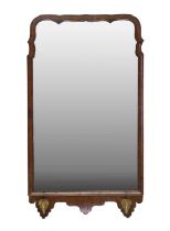 A George II Walnut Framed Mirror, circa 1750, the later plain mirror plate within a moulded and