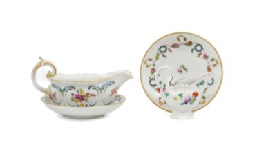 A Chelsea Porcelain Sauceboat, circa 1760, with scroll moulded handle and border, painted with