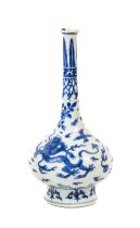 A Chinese Porcelain Bottle Vase, Kangxi, painted in underglaze blue with dragons chasing the flaming
