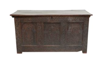 A Mid 17th Century Joined Oak Chest, the moulded hinged lid enclosing a vacant interior above an S-