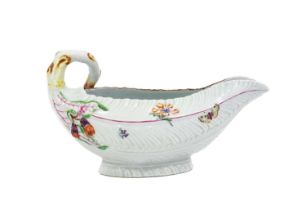 A Worcester Porcelain Cos Lettuce Leaf Sauceboat, circa 1756, painted with scattered flowersprigs