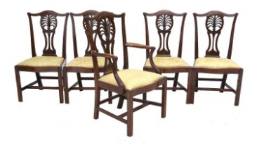 A Set of Five (4+1) George III Carved Mahogany Dining Chairs, late 18th century, with drop-in