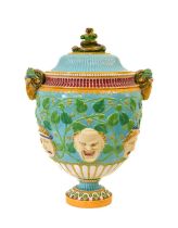 A Minton Majolica Urn, 1864, of ovoid form with serpent finial and ram's mask handles, moulded