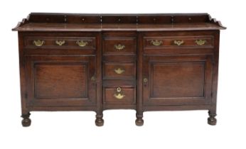 An English Joined Oak Dresser Base, Westmorland, 2nd quarter 18th century, the narrow upstand