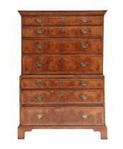 A George II-Style Walnut, Crossbanded and Featherbanded Straight-Front Chest of Drawers, the moulded