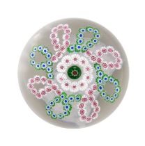 A Clichy Garland Paperweight, circa 1850, the central cane within a band of white canes and a green,