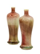 A Pair of Chinese Sang de Boeuf Glazed Porcelain Vases, Qing Dynasty, of baluster form with