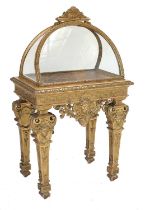 A Late 19th Century French Renaissance-Style Carved Giltwood Bijouterie Table, the domed top with