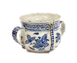 A Delft Posset Pot, London or Bristol, circa 1710, of ovoid form with flared neck and strap handles,