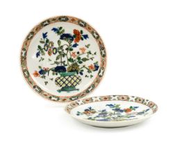 A Pair of Chinese Porcelain Saucers, Kangxi, painted in famille verte enamels with baskets of