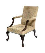 ~ A George III Carved Mahogany Gainsborough-Style Library Armchair, circa 1780, recovered in worn