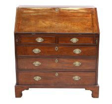 A George III Mahogany Bureau, late 18th century, the fall front enclosing a good fitted interior