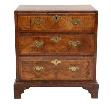 A George II Figured Walnut, Crossbanded and Featherbanded Straight-Front Chest of Drawers, mid