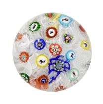 A Baccarat Spaced Millefiori Paperweight, dated 1848, the canes including various silhouettes and