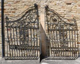 A Pair of Wrought Iron and Cast Iron Gates, of scrolled rectangular form, with foliate cast
