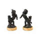 French School (19th century): A Pair of Bronze Figures of Cherubs, one holding a figure, the other