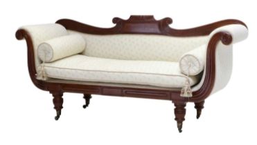 A Regency Style Carved Mahogany Scroll End Sofa, late 19th century, recovered in cream leaf