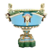 A Minton Majolica Jardiniere, circa 1870, of compressed urn form surmounted by two cherubs holding