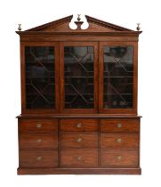 A Late George III Mahogany Triple-Door Library Bookcase, circa 1820, the moulded architectural