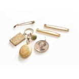 A Quantity of Jewellery, comprising of three tie pins, a locket with a 9 carat gold frame, and a