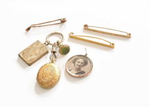 A Quantity of Jewellery, comprising of three tie pins, a locket with a 9 carat gold frame, and a