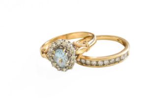 A 9 Carat Gold Aquamarine and Diamond Cluster Ring, finger size R; and A 9 Carat Gold Diamond Half