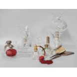 A Silver Backed Dressing Table Set, together with similar silver topped dressing table bottles and