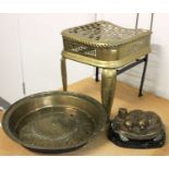 A 17th century German Brass Alms Dish, a 19th century brass footman, a reproduction bronze after
