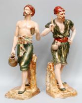 A Pair of Nautilus Porcelain Figures, modelled as Turkish water carriers, on naturalistic bases,