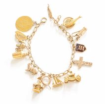 A Trace Link Bracelet, stamped ‘9CT’, suspending fifteen charms including an elephant, a cross, a