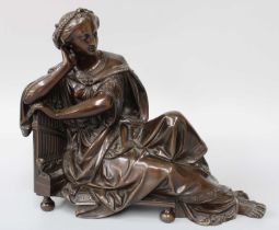 A Patinated Bronze Sculpture, 19th century, depicting St Cecilia, 28cm long