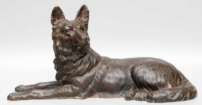 A Patinated Bronze Model of a Recumbent German Shepherd, early 20th century, 48cm long