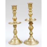 A Near Pair of Heemskirk-Type Bronze Candlesticks, with drip trays, 22cm high