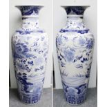 A Pair of Japanese Arita Floor Vases, Showa period, painted in underglaze blue with swans in flight,