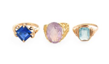 An Amethyst Ring, indistinctly marked, finger size K; A 9 Carat Gold Synthetic Spinel Ring, finger