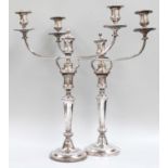 A Pair of Old Sheffield Plate Three-Light Candelabra, each on circular gadrooned base, the