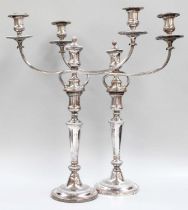 A Pair of Old Sheffield Plate Three-Light Candelabra, each on circular gadrooned base, the