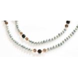 A Cultured Pearl and Smoky Quartz Necklace, length 140cm (approximately) Gross weight 154.7 grams.