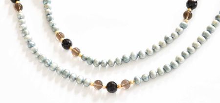 A Cultured Pearl and Smoky Quartz Necklace, length 140cm (approximately) Gross weight 154.7 grams.