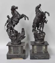 A Pair of Victorian Spelter Marly Horses, on slate and marble plinths, 52cm high