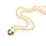 A Cultured Pearl Necklace, with A Ruby and Cultured Pearl Cluster Clasp, the seventy-one cultured