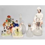 Four Staffordshire Flat Back Figures and Three Decanters, two with silver collars (one tray)