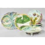 A Set of Eight 19th Century French Faience Asparagus and Artichoke Plates, each stamped "Luneville";