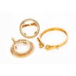 Three 9 Carat Gold Coin Mounts, comprising of a ring and two pendants Gross weight 13.7 grams.