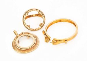 Three 9 Carat Gold Coin Mounts, comprising of a ring and two pendants Gross weight 13.7 grams.