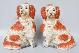 A Pair of Reproduction Staffordshire Style Pottery Spaniels, moulded with padlock collars and