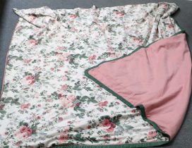 A Floral Bed Cover, with green trim and pink reverse