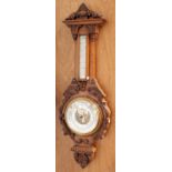 A Late Victorian Carved Oak Aneroid Barometer, 97cm high Oak case in good order. Dials in fair
