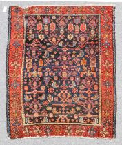 Heriz Rug North West Iran, circa 1930 The deep brick red field with a column of medallions